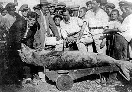 Islanders posing with a dead seal